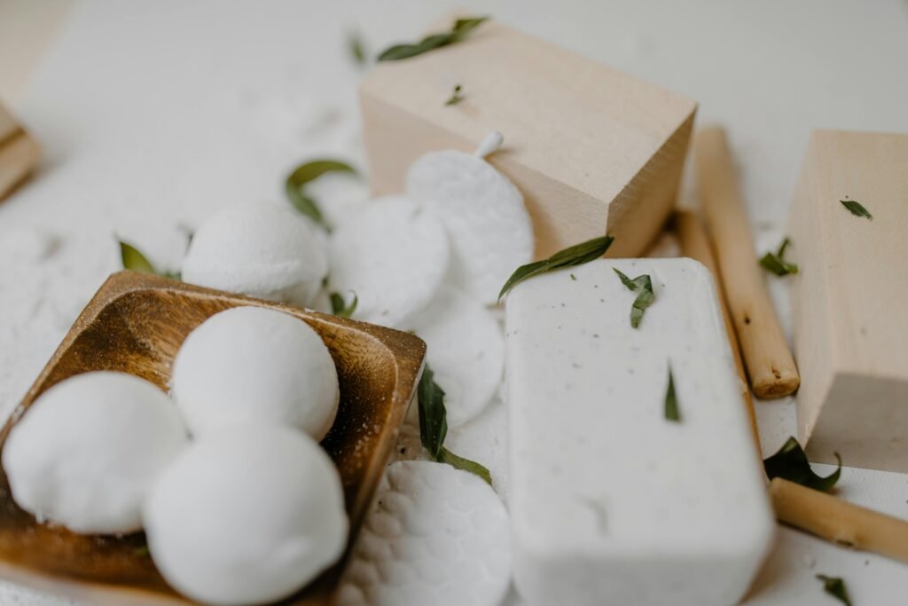 Elegant arrangement of spa essentials with natural soap and bath bombs, perfect for self-care routines.